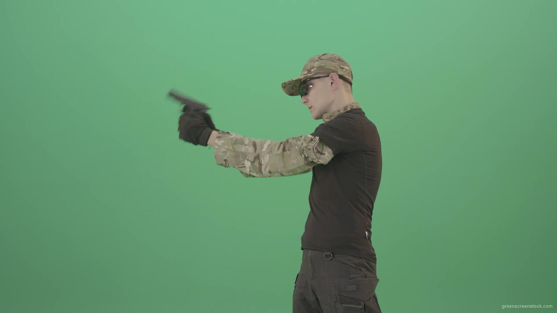 Army-Man-Assassin-shooting-with-small-gun-isolated-on-green-screen-4K-Video-Footage-1920_008 Green Screen Stock