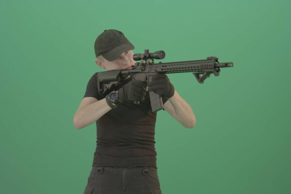 Army strike soldier with gun on green screen