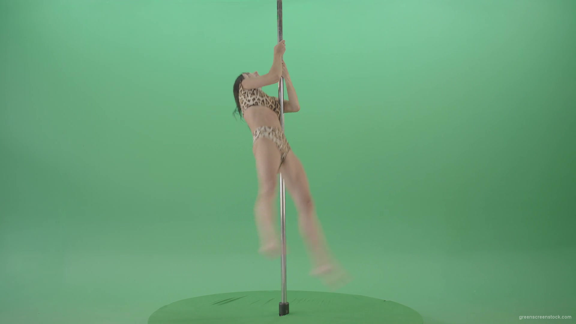 vj video background Athletic-sexy-female-model-spinning-on-pilon-in-jaguar-skin-underwear-dancing-pole-dance-on-Green-Screen-4K-Video-Footage-1920_003