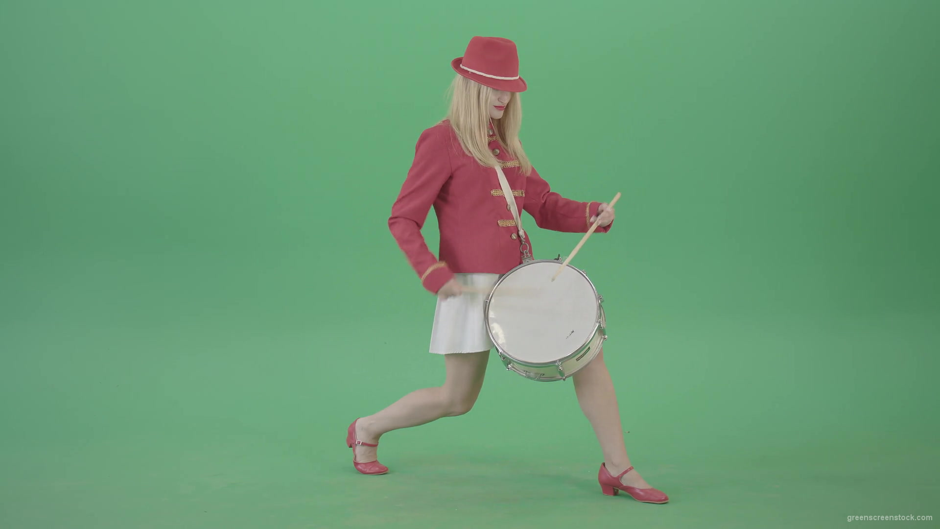 vj video background Blonde-Girl-in-Red-Uniform-making-beats-on-music-drum-instrument-in-active-pose-on-green-screen-4K-Video-Footage-1920_003