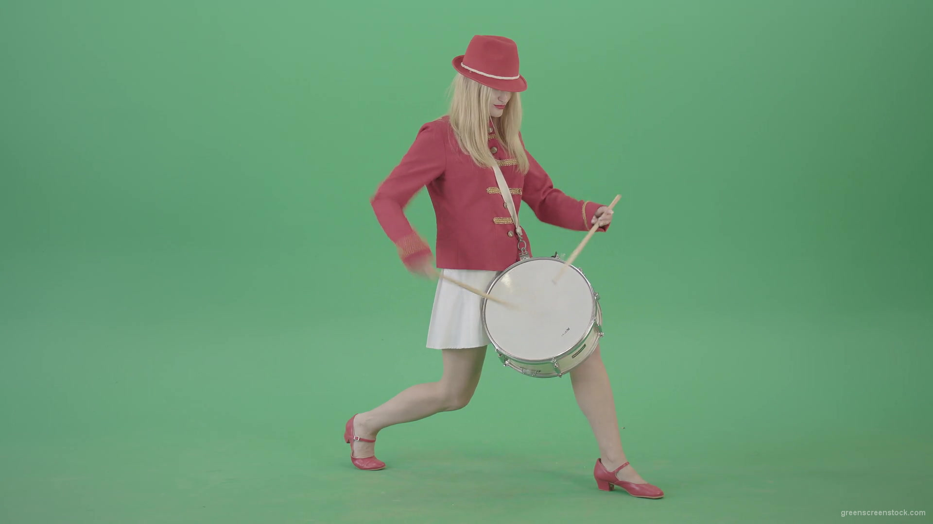 Blonde-Girl-in-Red-Uniform-making-beats-on-music-drum-instrument-in-active-pose-on-green-screen-4K-Video-Footage-1920_007 Green Screen Stock