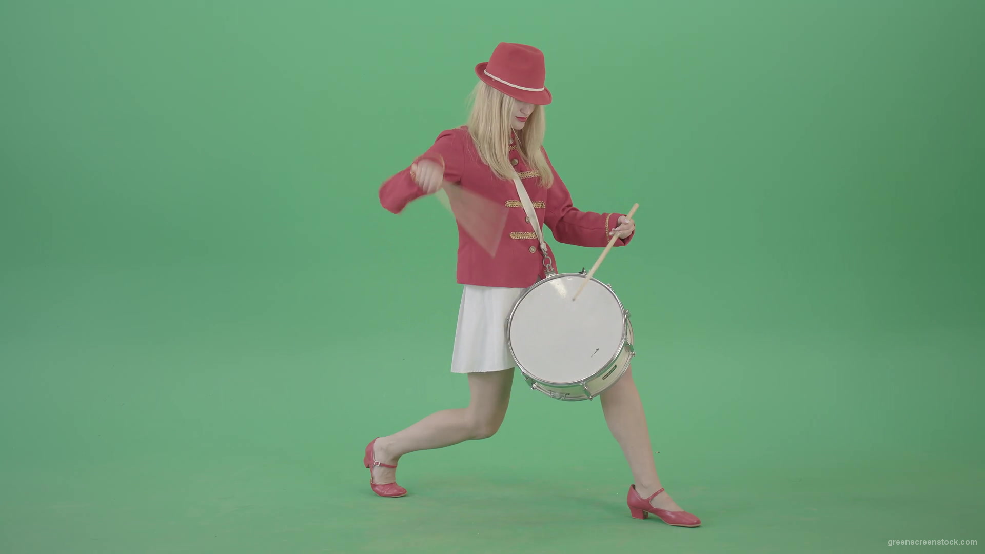 Blonde-Girl-in-Red-Uniform-making-beats-on-music-drum-instrument-in-active-pose-on-green-screen-4K-Video-Footage-1920_008 Green Screen Stock