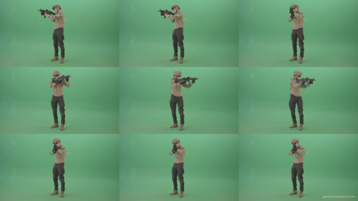 Boy-in-military-uniform-shooting-with-gun-machine-on-virtual-was-over-green-screen-4K-Video-Footage-1920 Green Screen Stock