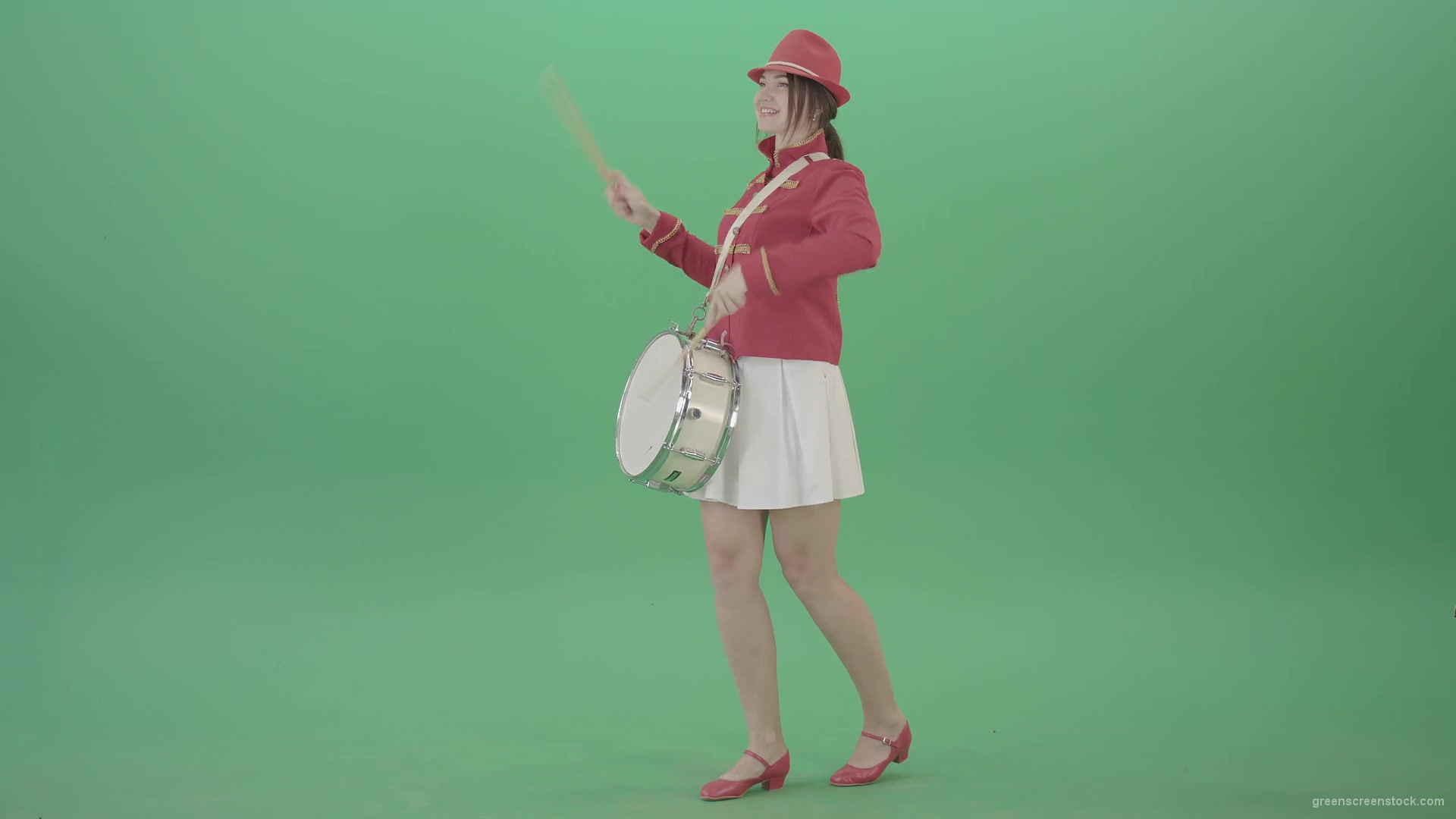 Funny-Girl-in-red-white-uniform-makes-percussion-and-play-drums-isolated-on-green-screen-4K-Video-Footage-1920_006 Green Screen Stock