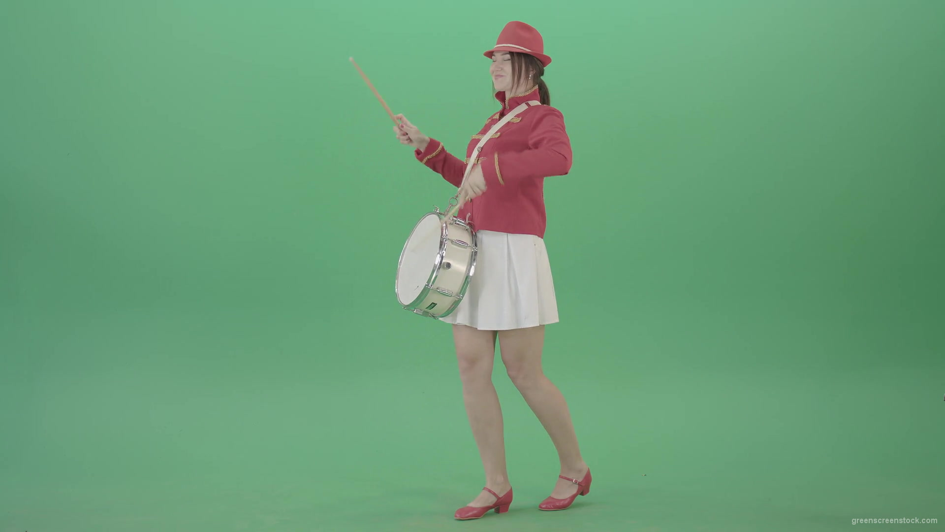 Funny-Girl-in-red-white-uniform-makes-percussion-and-play-drums-isolated-on-green-screen-4K-Video-Footage-1920_008 Green Screen Stock
