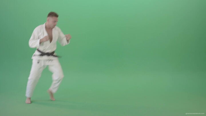 vj video background Ju-jutsu-young-man-training-slowly-karate-isolated-on-green-screen-4K-Video-Footage-1920_003