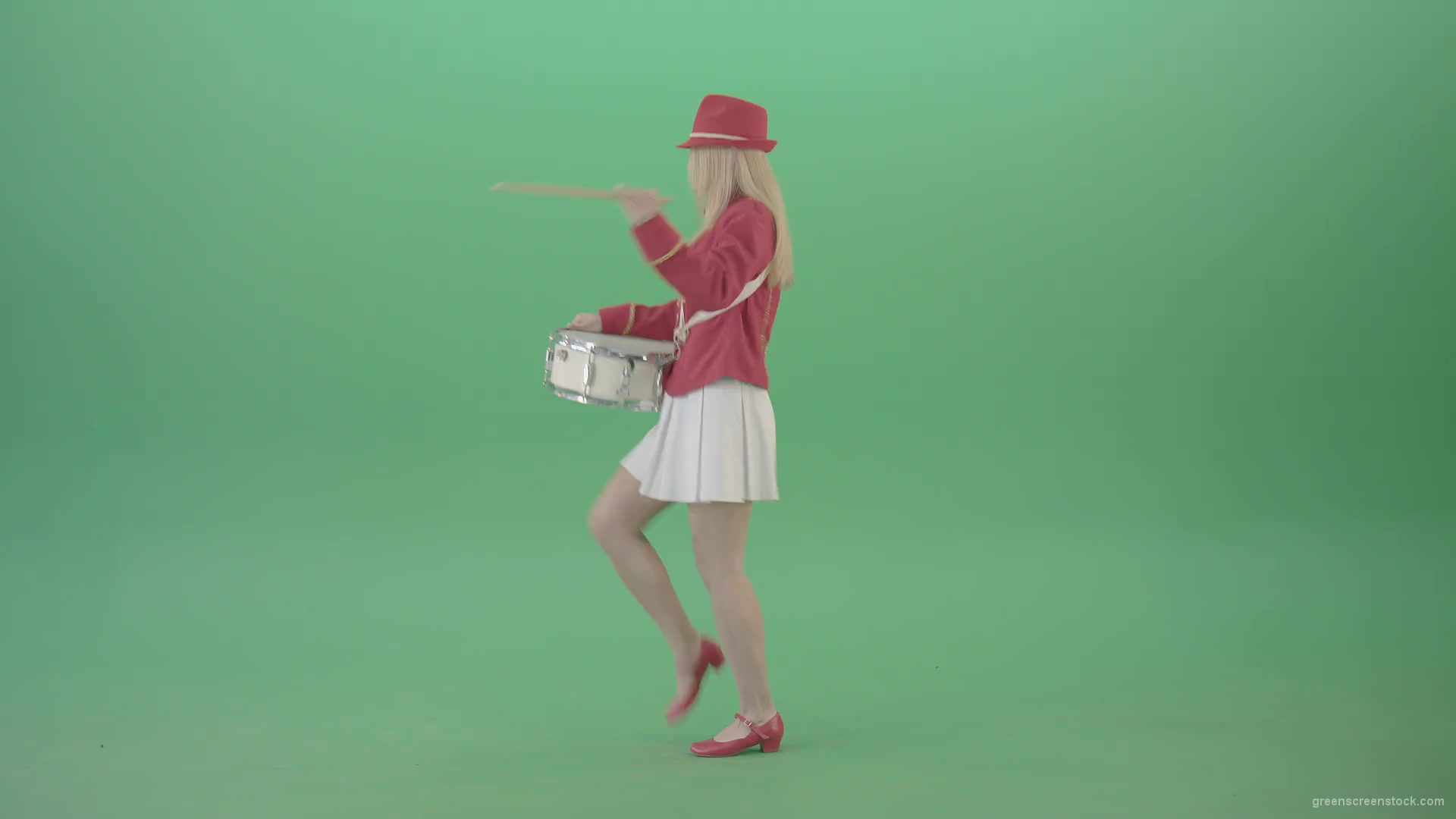 Side-view-of-blonde-girl-in-red-costume-playing-drums-isolated-on-green-screen-4K-Video-Footage-1920_001 Green Screen Stock