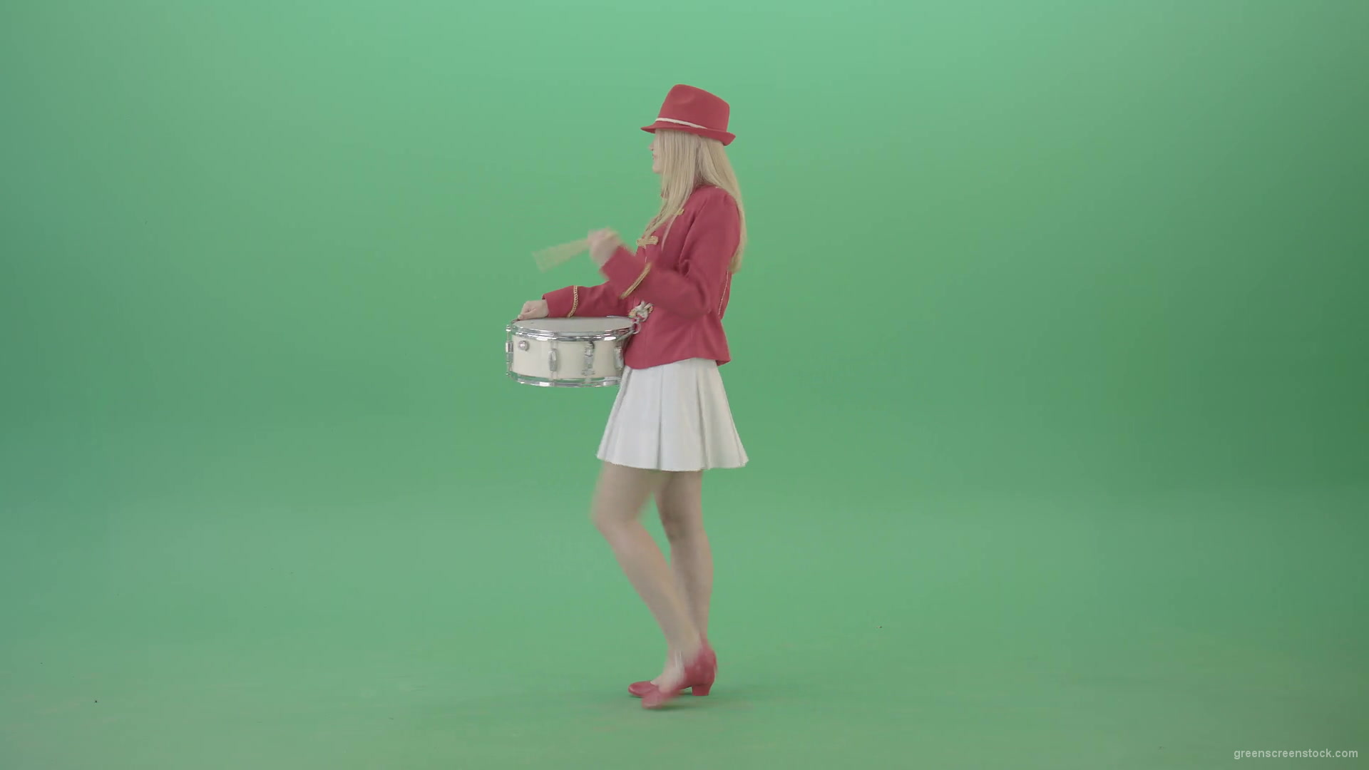 Side-view-of-blonde-girl-in-red-costume-playing-drums-isolated-on-green-screen-4K-Video-Footage-1920_005 Green Screen Stock