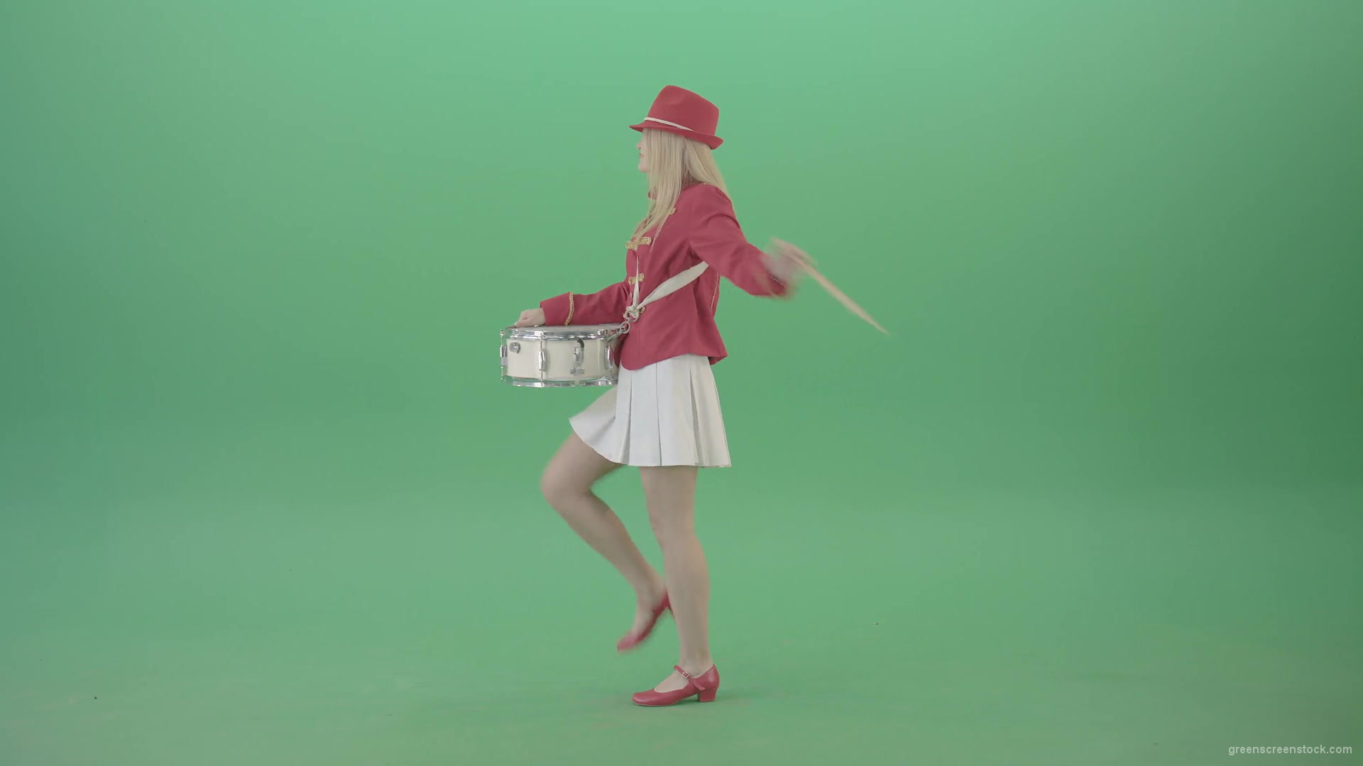 Side-view-of-blonde-girl-in-red-costume-playing-drums-isolated-on-green-screen-4K-Video-Footage-1920_006 Green Screen Stock
