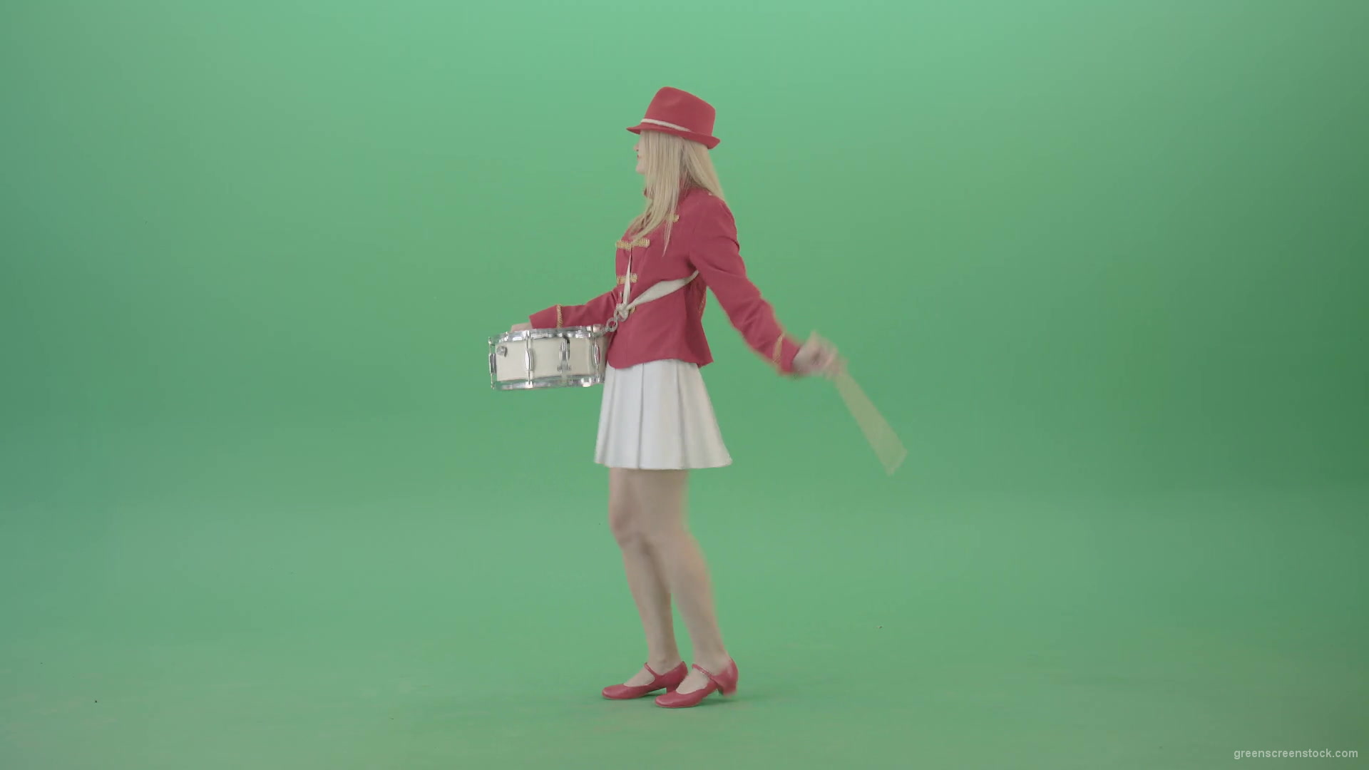 Side-view-of-blonde-girl-in-red-costume-playing-drums-isolated-on-green-screen-4K-Video-Footage-1920_009 Green Screen Stock