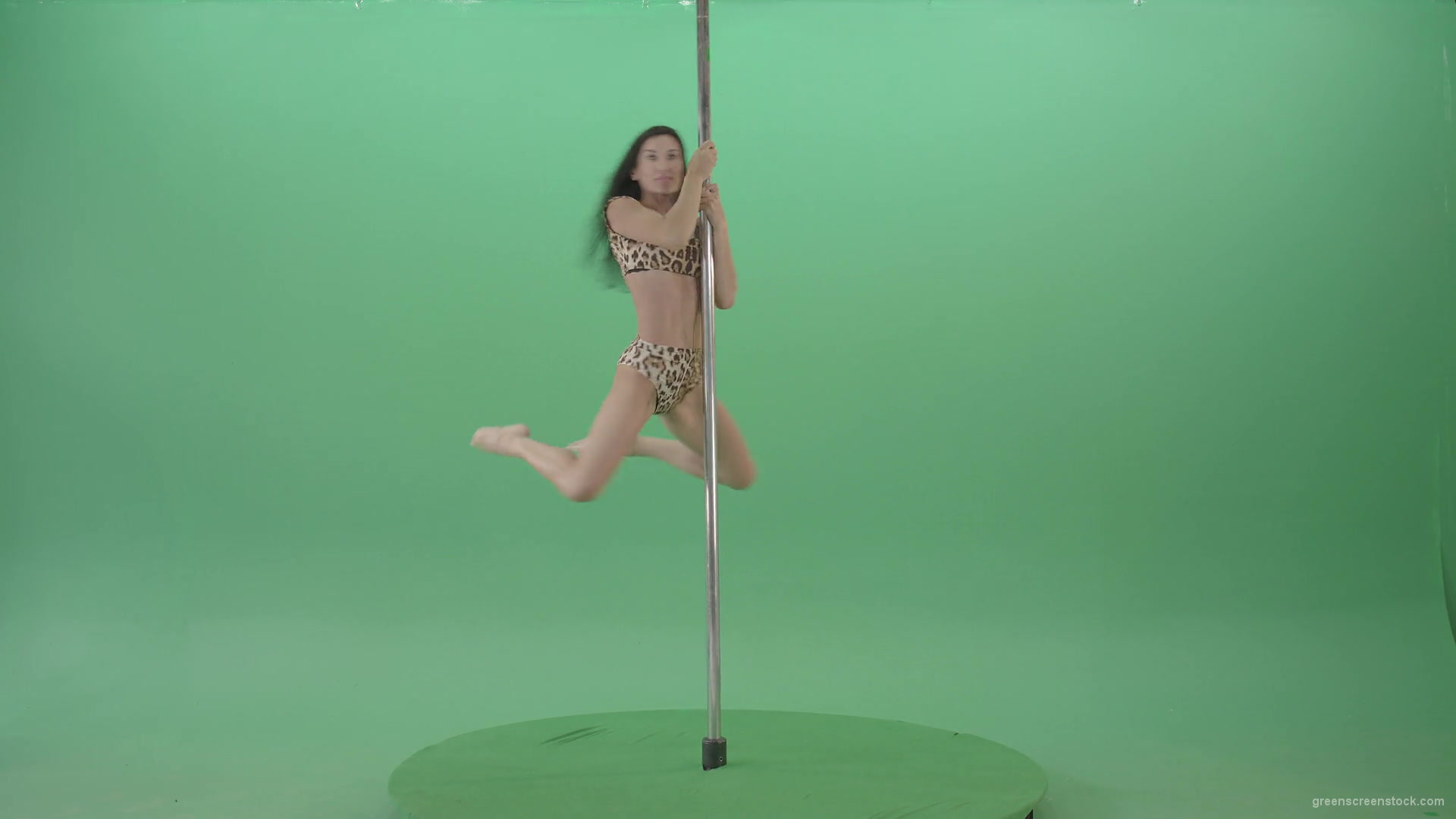 Slim-woman-spinning-in-simple-pose-dancing-pole-dance-in-animal-jaguar-skin-underwear-on-green-screen-4K-Video-Footage-1920_006 Green Screen Stock