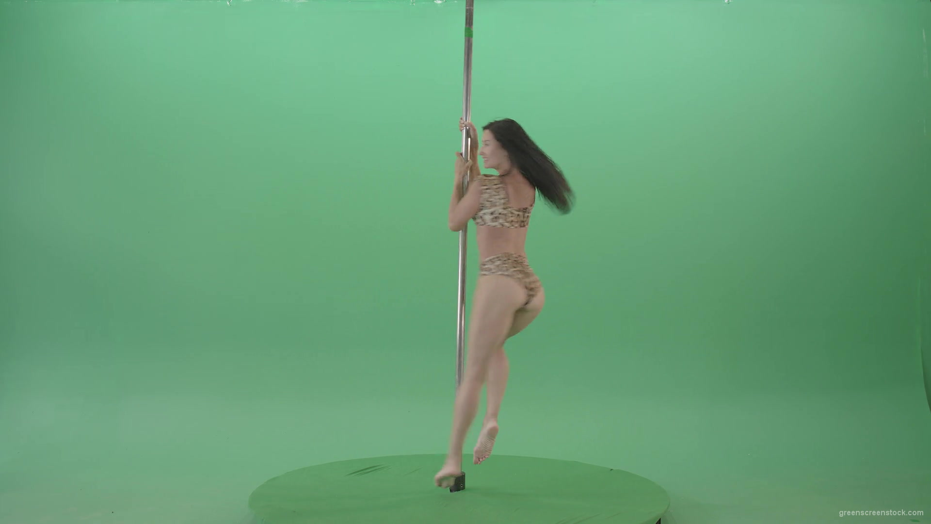 Slim-woman-spinning-in-simple-pose-dancing-pole-dance-in-animal-jaguar-skin-underwear-on-green-screen-4K-Video-Footage-1920_009 Green Screen Stock