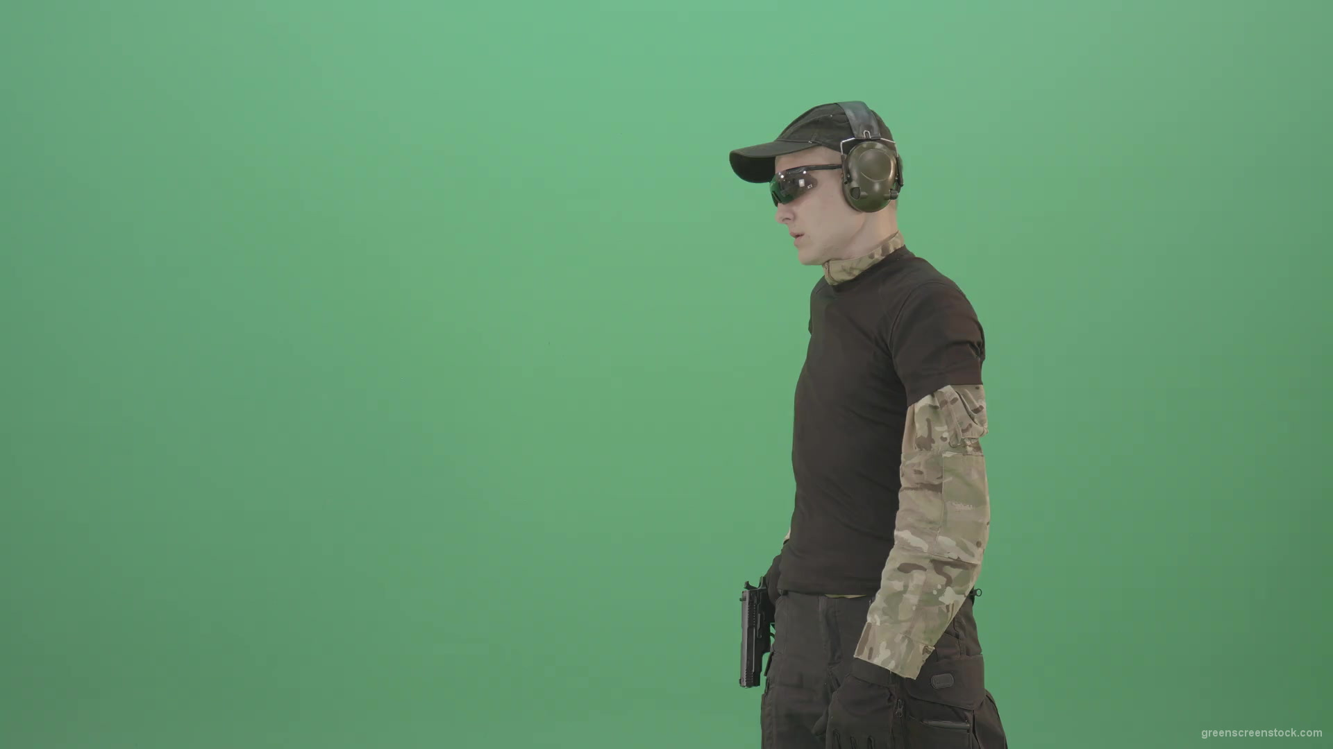Young-boy-sodier-testin-small-pistol-gun-and-shooting-isolated-on-green-screen-4K-Video-Footage-1920_001 Green Screen Stock