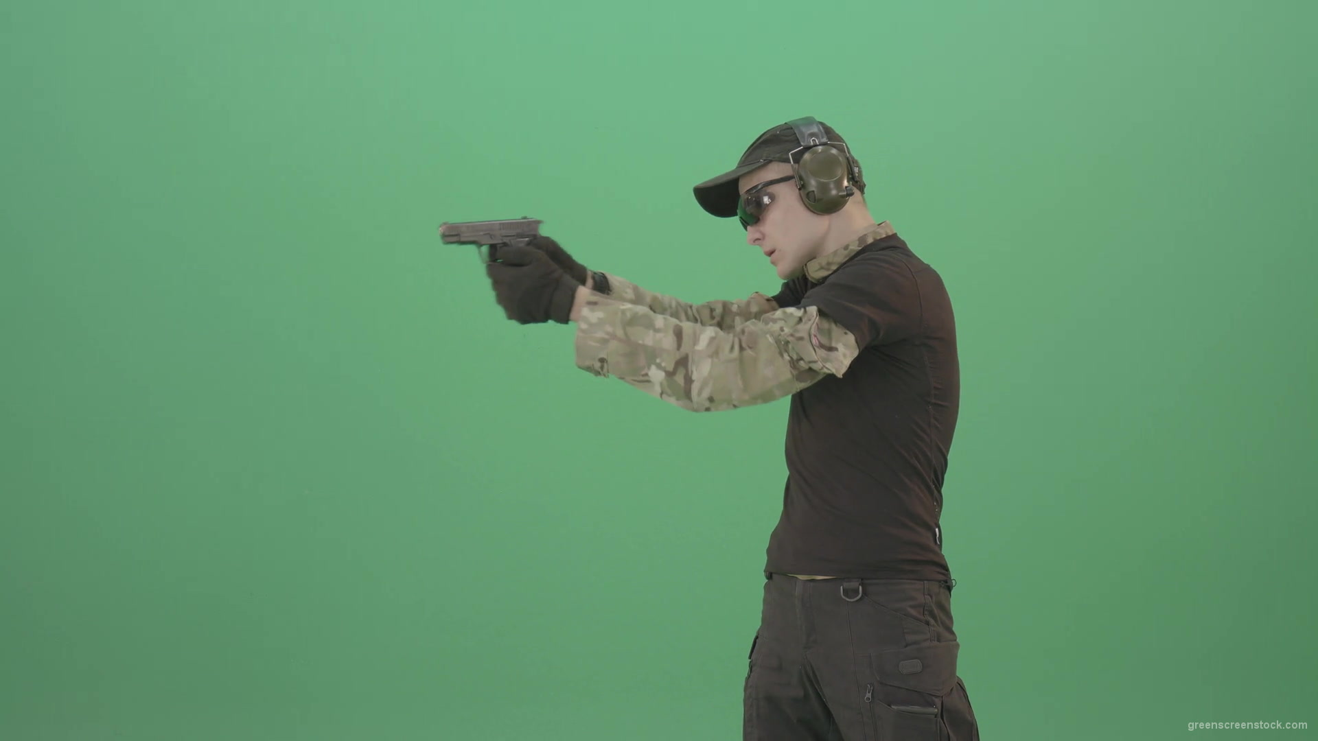 Young-boy-sodier-testin-small-pistol-gun-and-shooting-isolated-on-green-screen-4K-Video-Footage-1920_002 Green Screen Stock