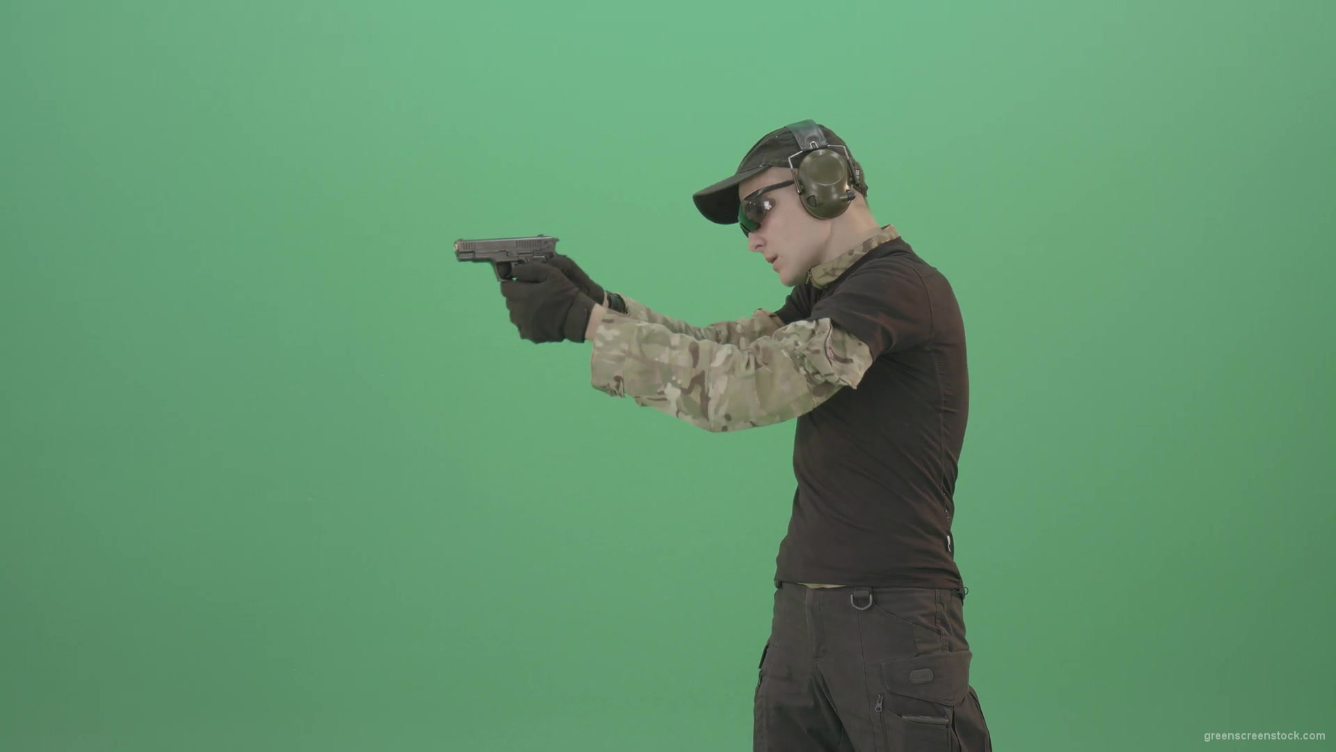 vj video background Young-boy-sodier-testin-small-pistol-gun-and-shooting-isolated-on-green-screen-4K-Video-Footage-1920_003