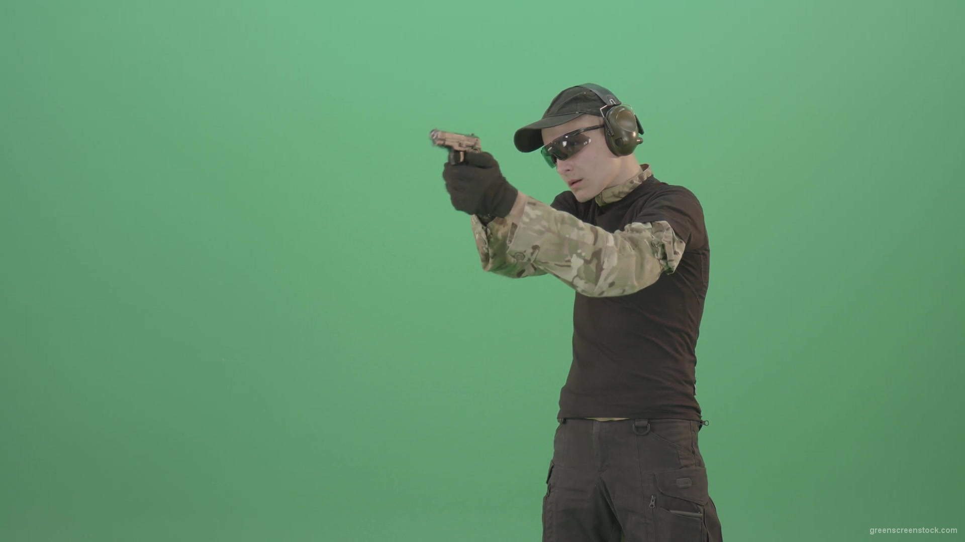 Young-boy-sodier-testin-small-pistol-gun-and-shooting-isolated-on-green-screen-4K-Video-Footage-1920_004 Green Screen Stock