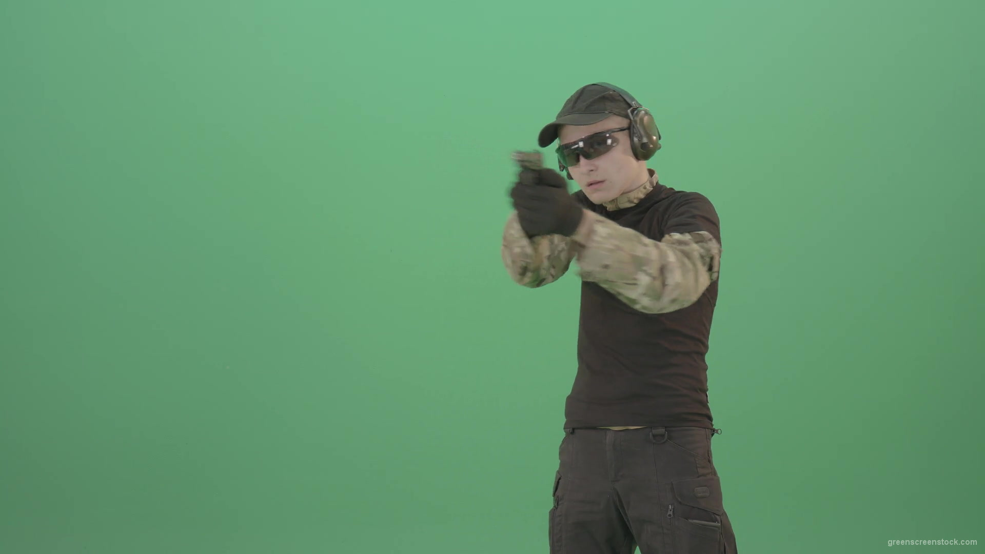 Young-boy-sodier-testin-small-pistol-gun-and-shooting-isolated-on-green-screen-4K-Video-Footage-1920_005 Green Screen Stock