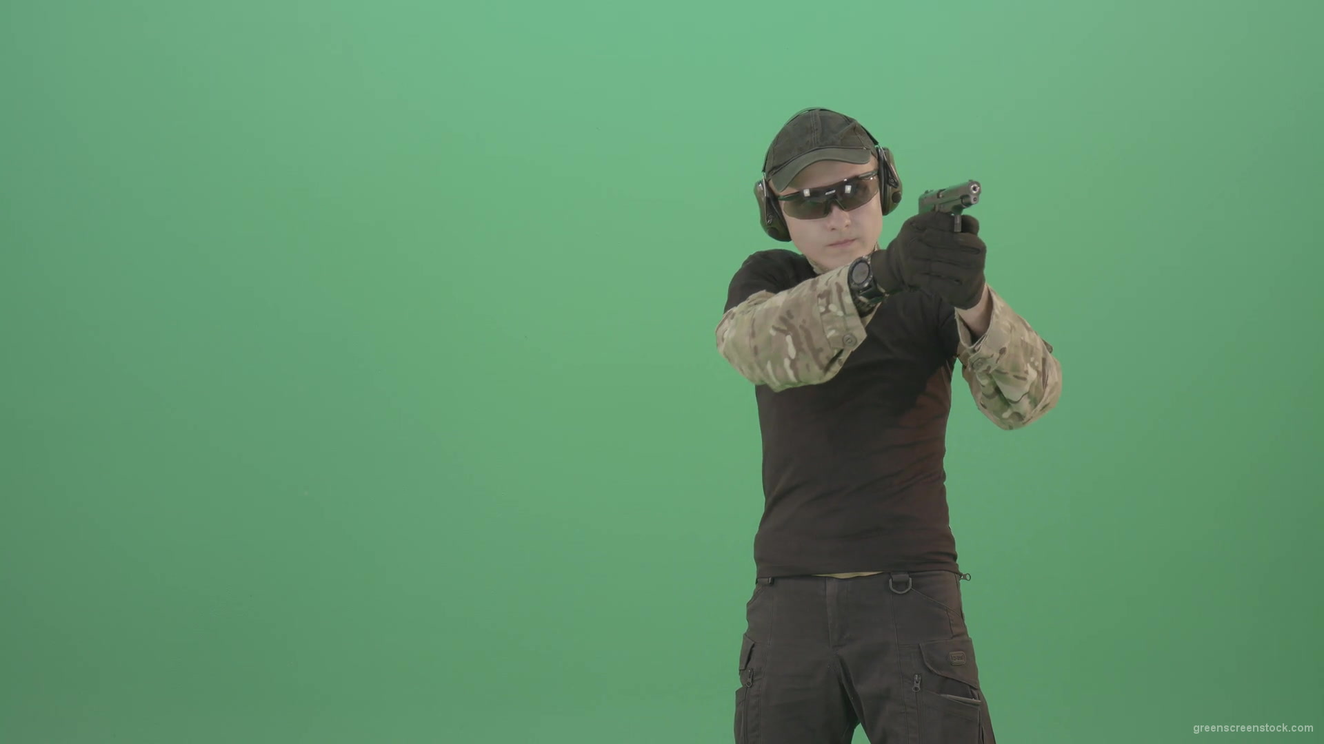 Young-boy-sodier-testin-small-pistol-gun-and-shooting-isolated-on-green-screen-4K-Video-Footage-1920_009 Green Screen Stock
