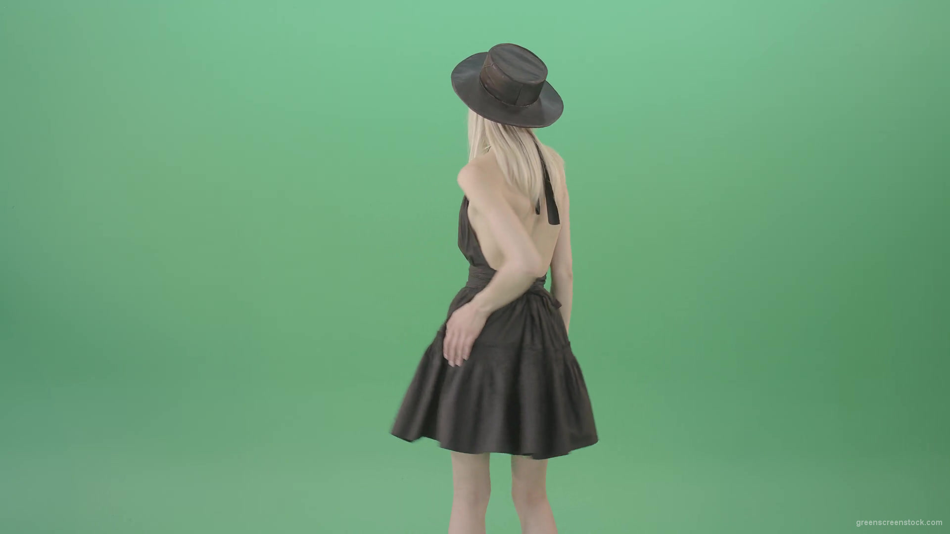 Blonde-girl-in-black-hat-with-open-back-posing-in-dark-dress-over-green-screen-4K-Video-Footage-1920_002 Green Screen Stock