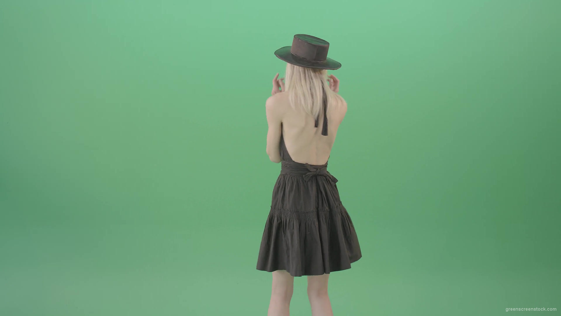 Blonde-girl-in-black-hat-with-open-back-posing-in-dark-dress-over-green-screen-4K-Video-Footage-1920_004 Green Screen Stock