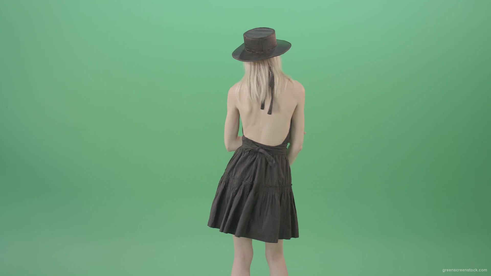 Blonde-girl-in-black-hat-with-open-back-posing-in-dark-dress-over-green-screen-4K-Video-Footage-1920_005 Green Screen Stock