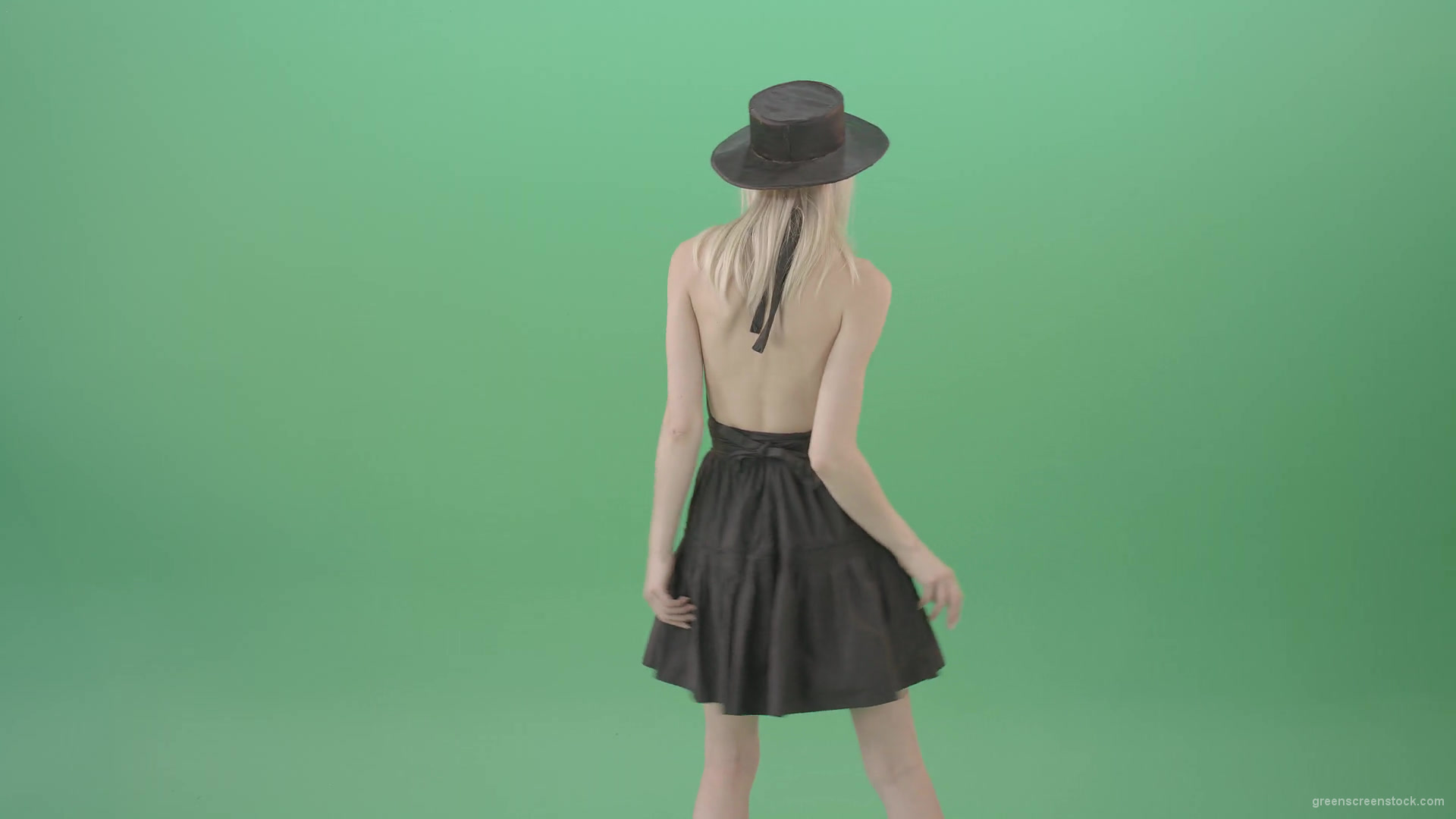 Blonde-girl-in-black-hat-with-open-back-posing-in-dark-dress-over-green-screen-4K-Video-Footage-1920_008 Green Screen Stock