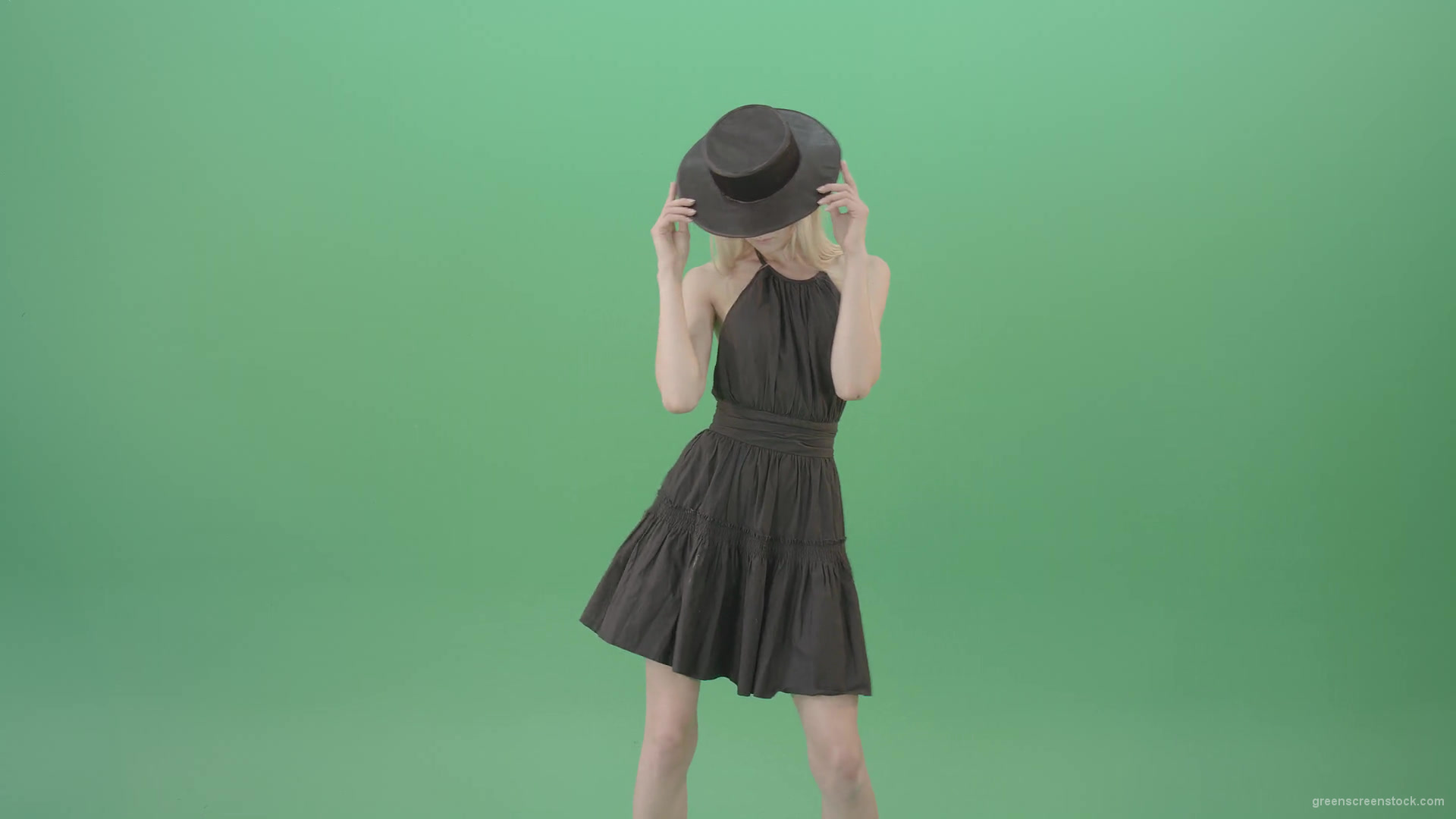 Elegant-girl-in-black-dress-and-hat-chilling-dance-isolated-on-green-screen-4K-Video-Footage-1920_007 Green Screen Stock