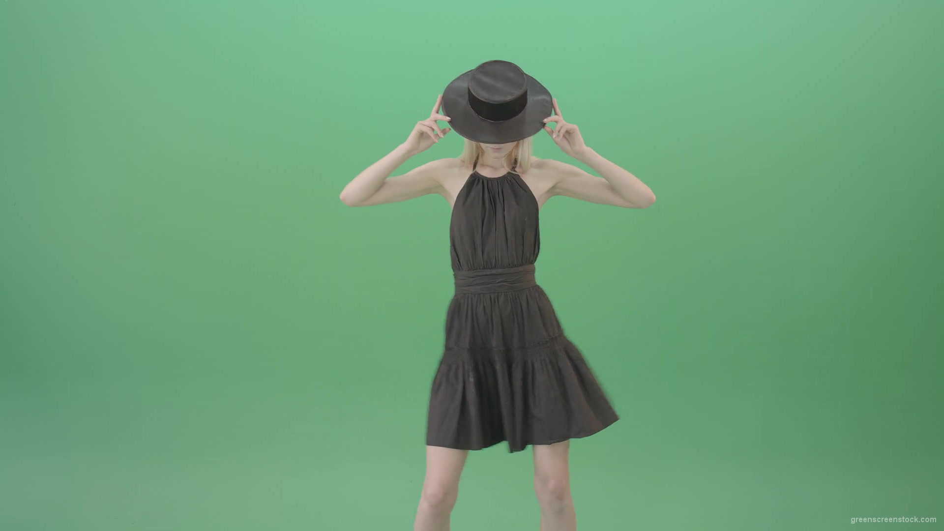 Elegant-girl-in-black-dress-and-hat-chilling-dance-isolated-on-green-screen-4K-Video-Footage-1920_008 Green Screen Stock