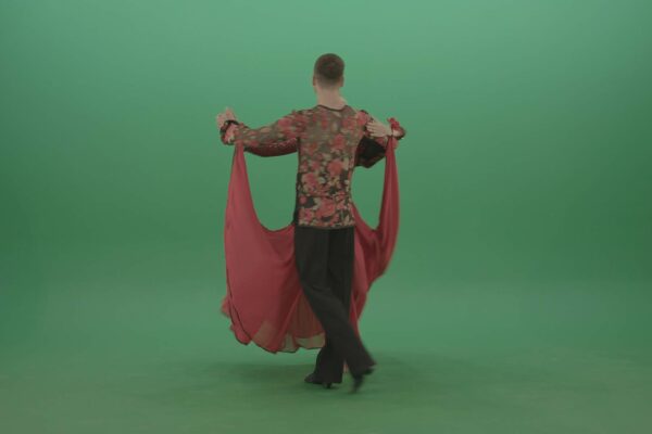 Couple in red costume dancing latina dance on green screen