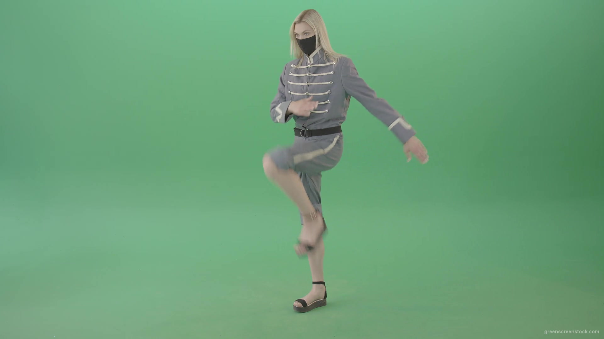 Young-Blonde-woman-marching-in-side-view-with-Covid19-mask-on-green-screen-4K-Video-Footage-1920_002 Green Screen Stock