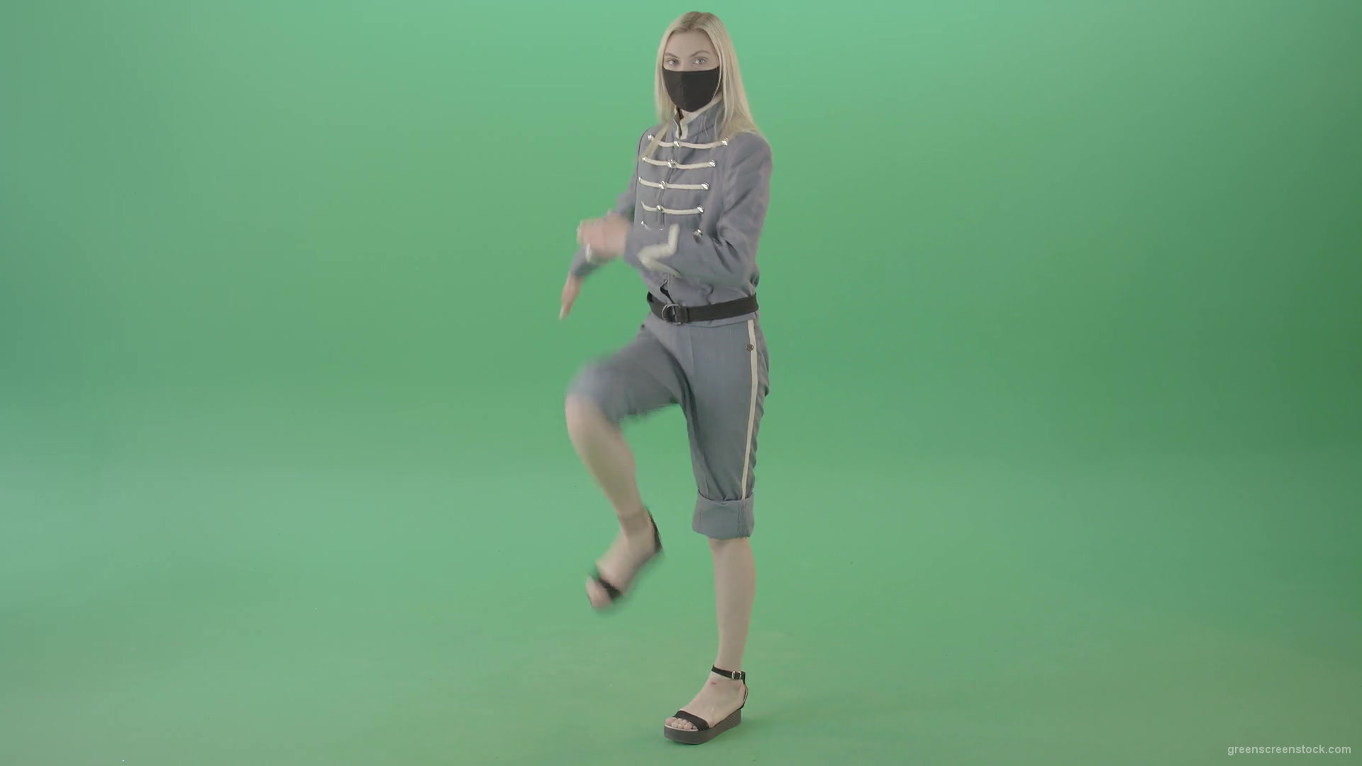 Young-Blonde-woman-marching-in-side-view-with-Covid19-mask-on-green-screen-4K-Video-Footage-1920_007 Green Screen Stock