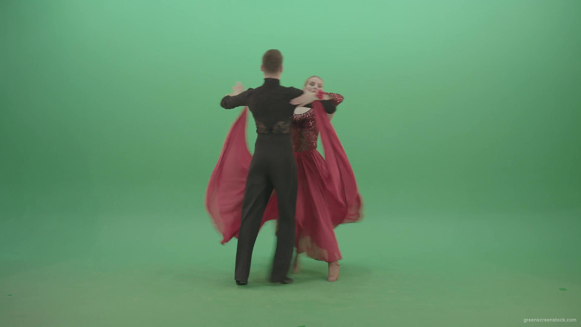Young-couple-in-red-black-costume-spinning-dancing-ballroom-latina-dance-over-green-screen-4K-Video-Footage-1920_004 Green Screen Stock