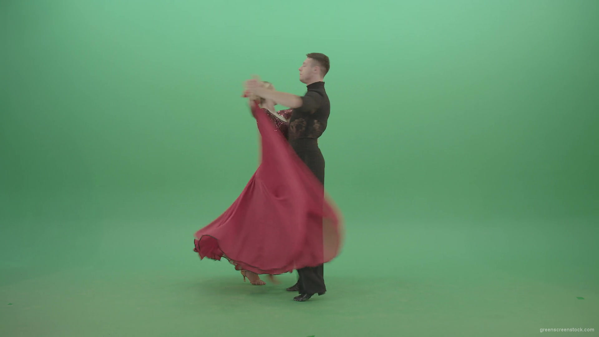 Young-couple-in-red-black-costume-spinning-dancing-ballroom-latina-dance-over-green-screen-4K-Video-Footage-1920_005 Green Screen Stock