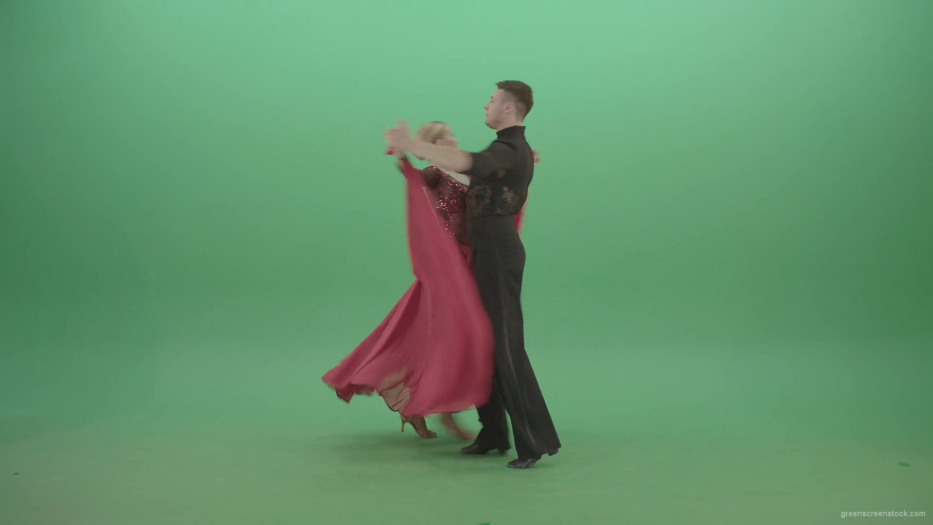 Young-couple-in-red-black-costume-spinning-dancing-ballroom-latina-dance-over-green-screen-4K-Video-Footage-1920_008 Green Screen Stock