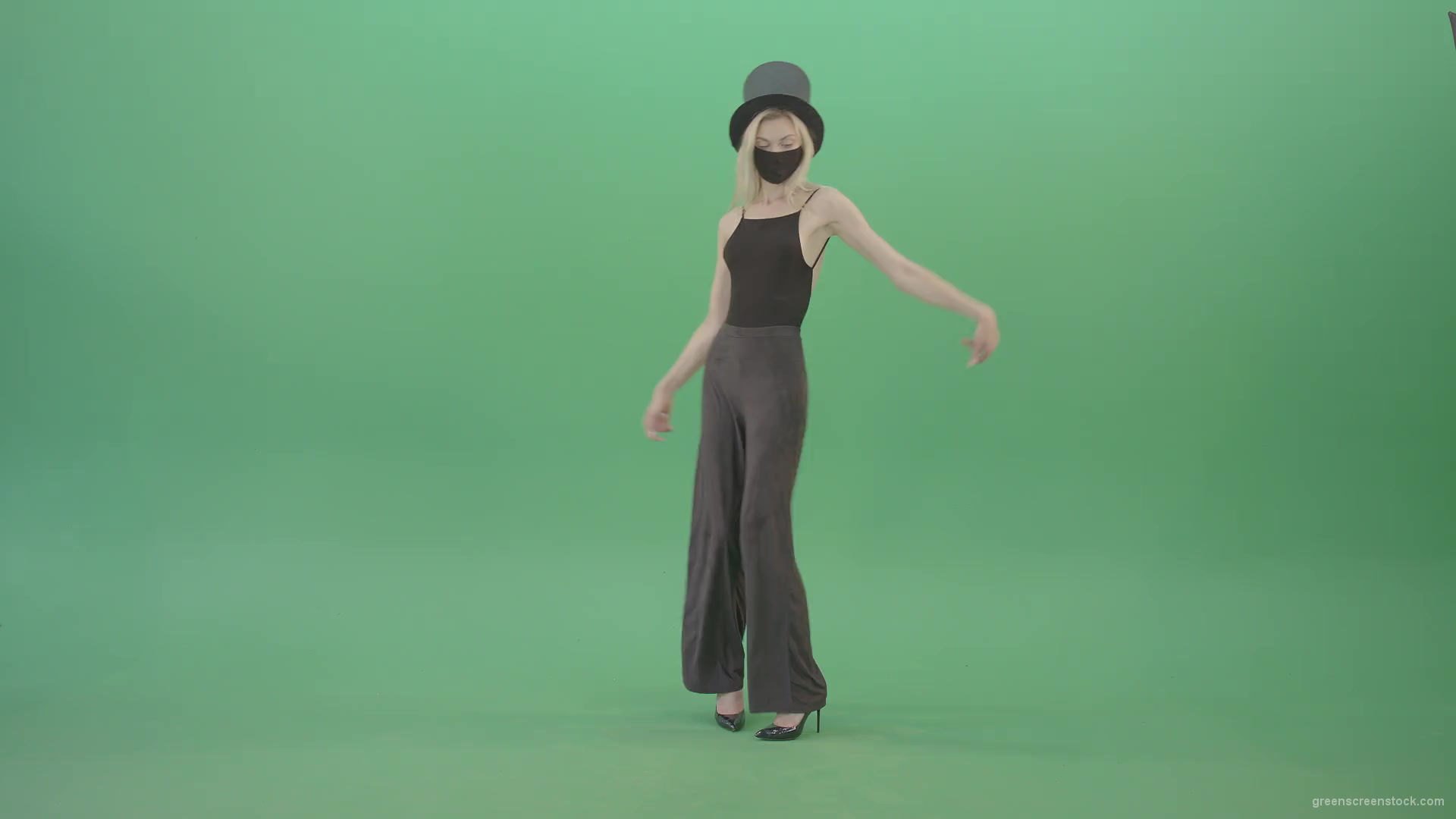 Blonde-Girl-in-Black-Cylinder-Hat-dancing-slowly-in-Corona-VIrus-Mask-on-green-screen-VIdeo-Footage-1920_001 Green Screen Stock