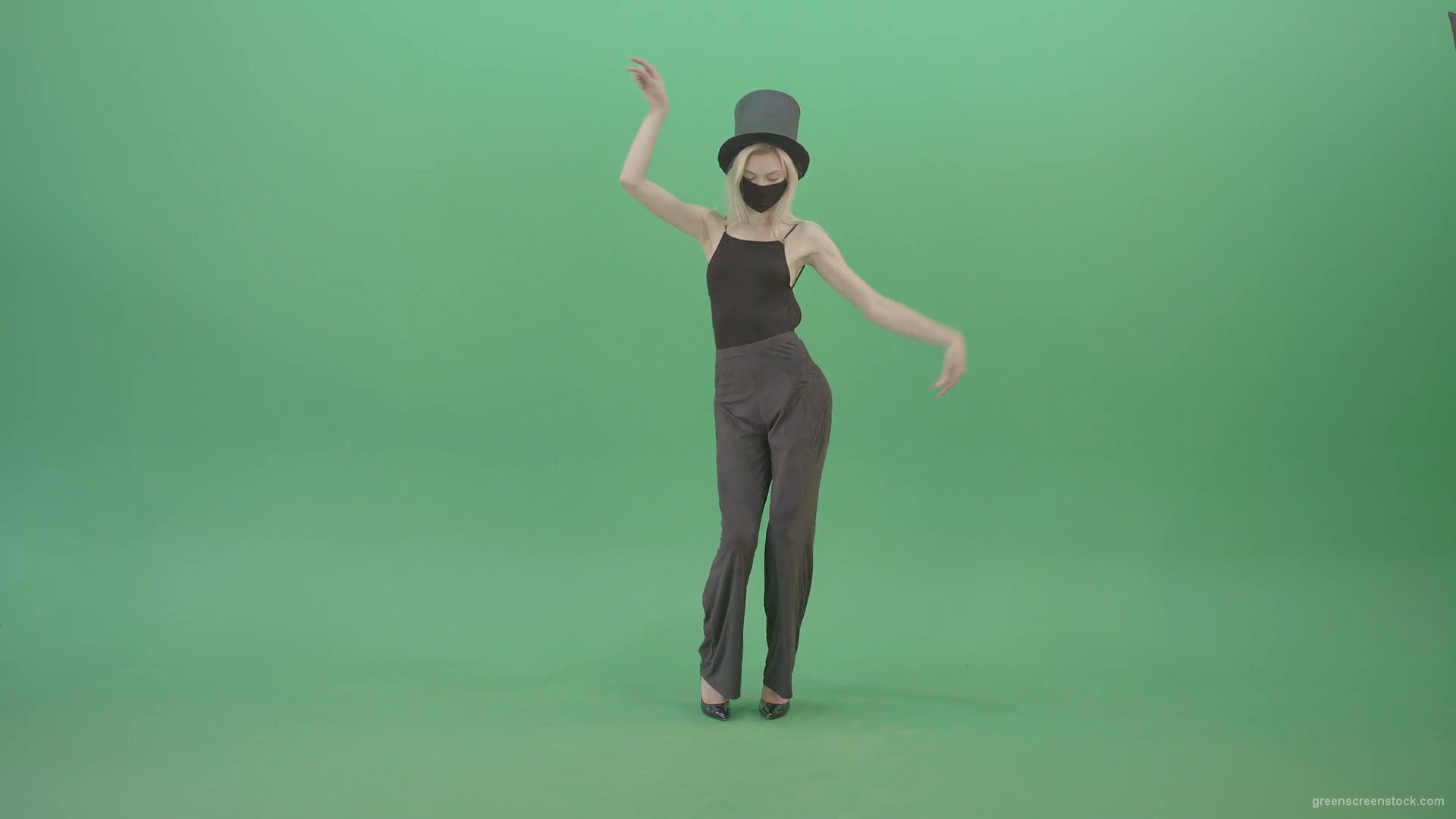 vj video background Blonde-Girl-in-Black-Cylinder-Hat-dancing-slowly-in-Corona-VIrus-Mask-on-green-screen-VIdeo-Footage-1920_003