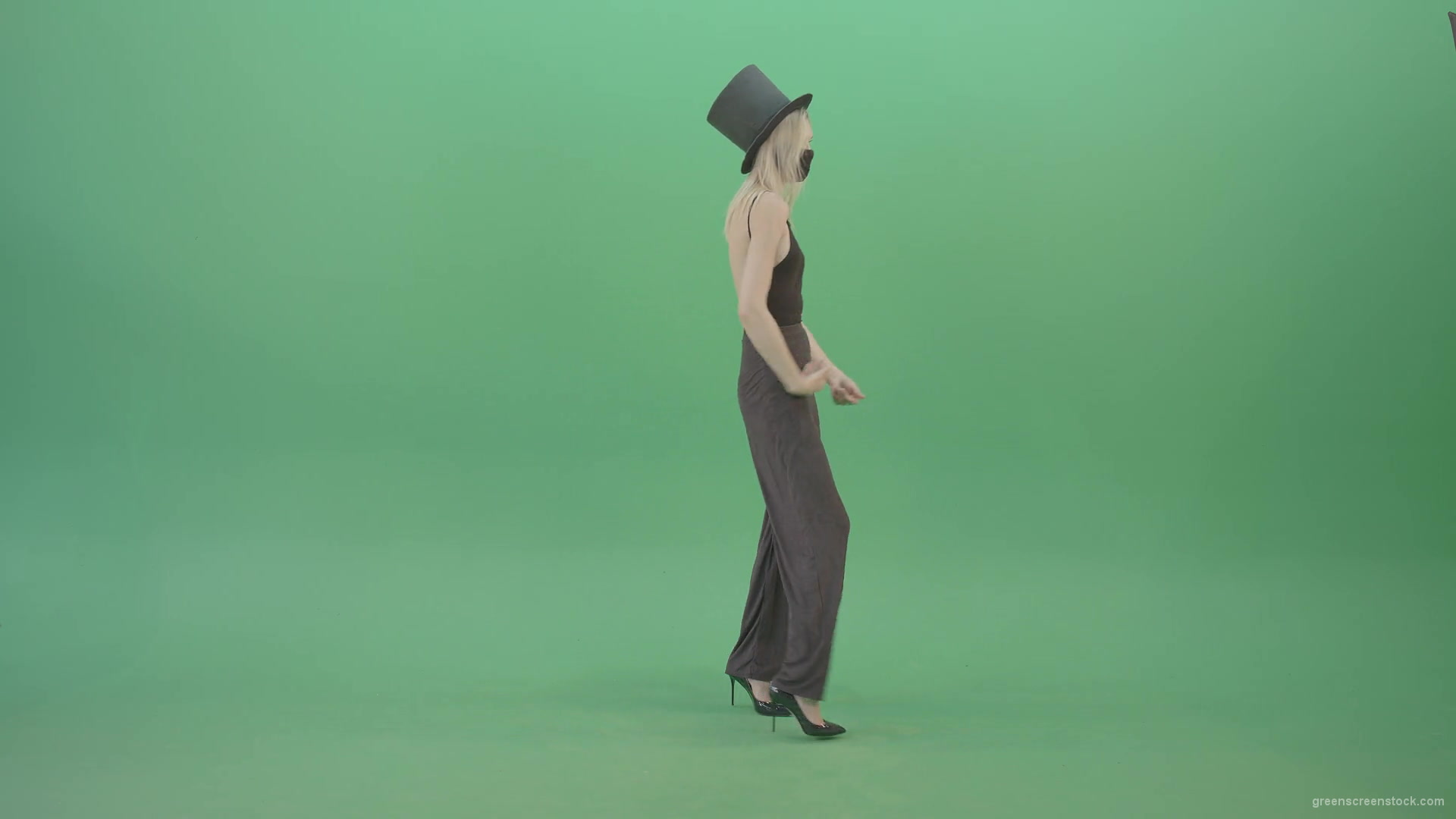 Blonde-Girl-in-Black-Cylinder-Hat-dancing-slowly-in-Corona-VIrus-Mask-on-green-screen-VIdeo-Footage-1920_004 Green Screen Stock