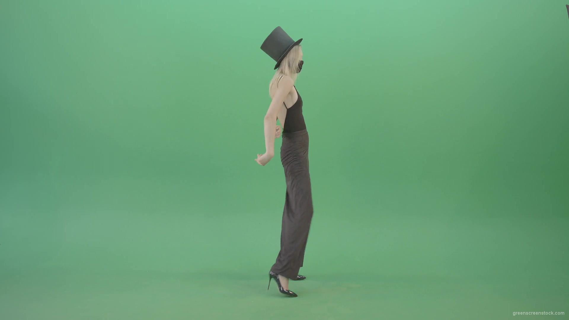 Blonde-Girl-in-Black-Cylinder-Hat-dancing-slowly-in-Corona-VIrus-Mask-on-green-screen-VIdeo-Footage-1920_005 Green Screen Stock