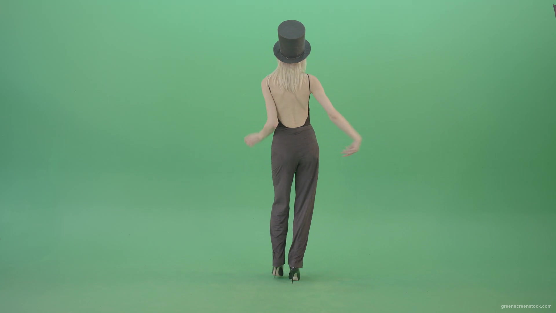 Blonde-Girl-in-Black-Cylinder-Hat-dancing-slowly-in-Corona-VIrus-Mask-on-green-screen-VIdeo-Footage-1920_006 Green Screen Stock