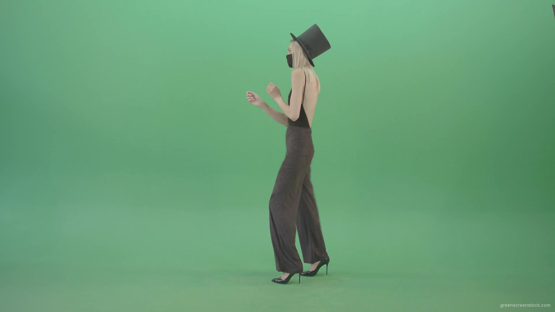 Covid-Mask-Girl-in-Black-cylinder-Hat-dancing-in-front-and-back-side-view-isolated-on-green-screen-Video-Footage-1920_005 Green Screen Stock
