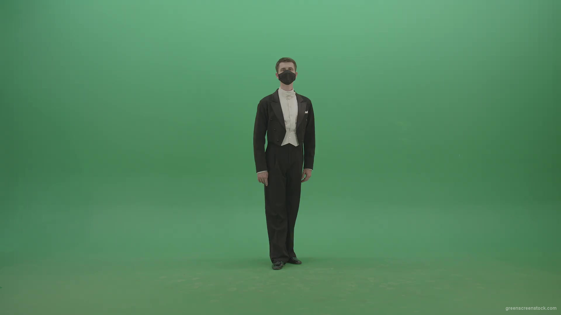 Man-in-Classical-ballroom-suite-making-wish-regards-to-impres-audience-in-black-medicine-mask-on-green-screen-4K-Video-Footage-1920_001 Green Screen Stock
