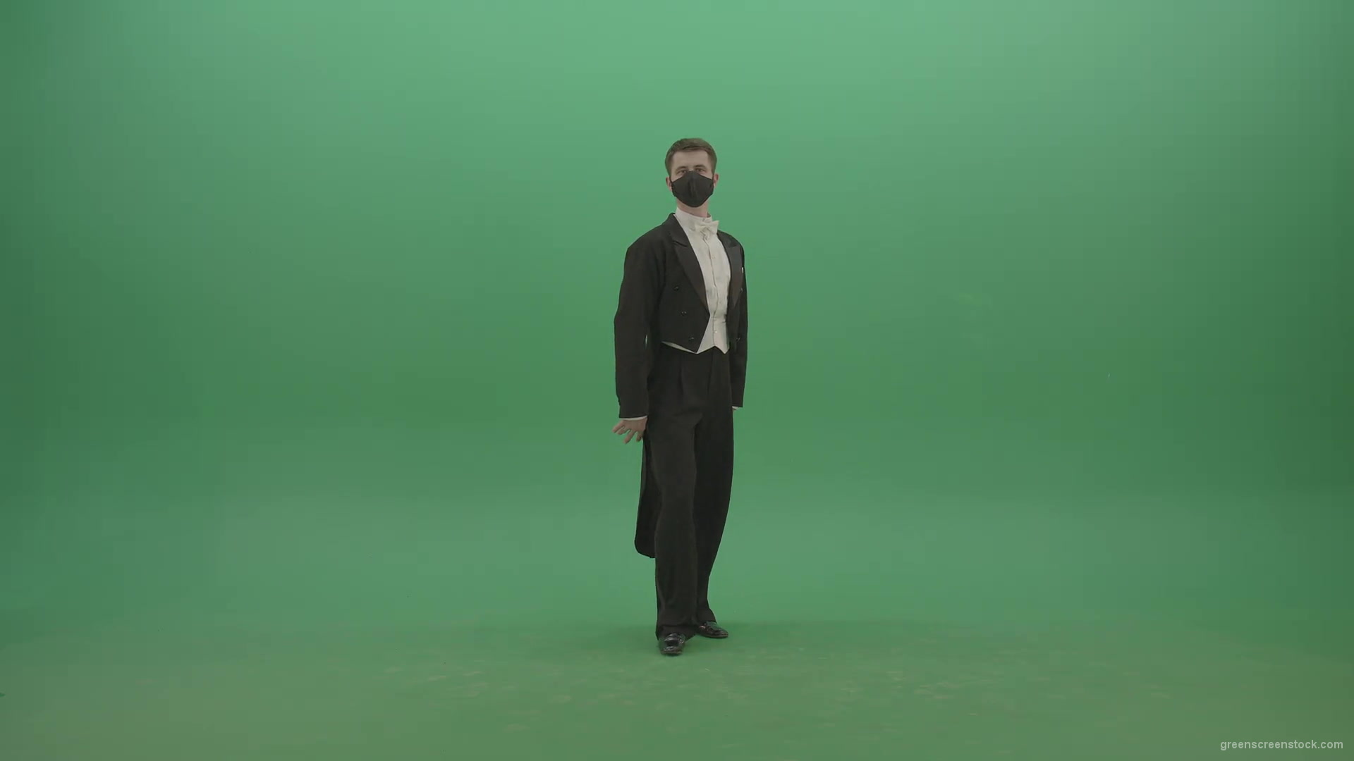 Man-in-Classical-ballroom-suite-making-wish-regards-to-impres-audience-in-black-medicine-mask-on-green-screen-4K-Video-Footage-1920_002 Green Screen Stock