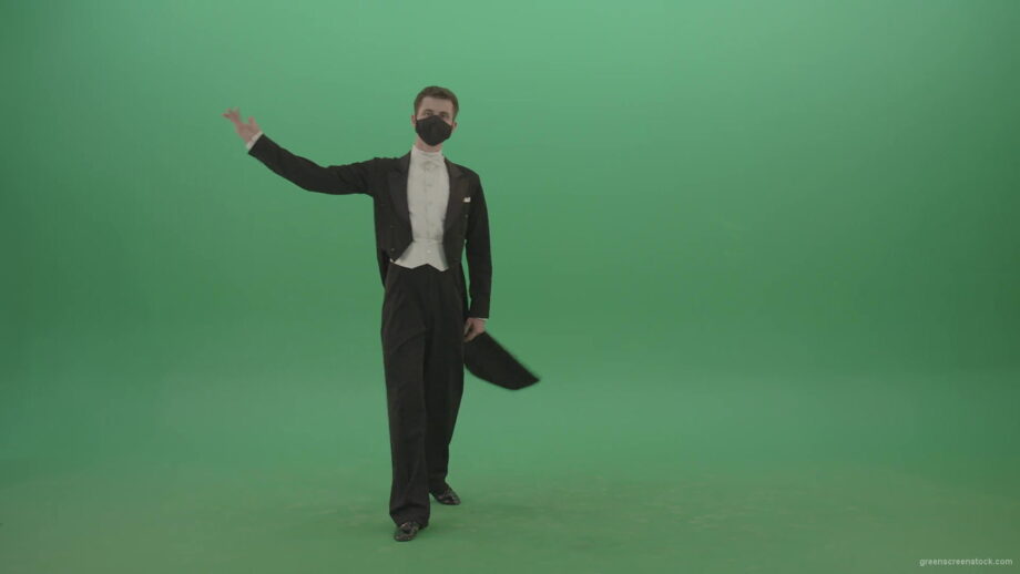 Man-in-Classical-ballroom-suite-making-wish-regards-to-impres-audience-in-black-medicine-mask-on-green-screen-4K-Video-Footage-1920_004 Green Screen Stock