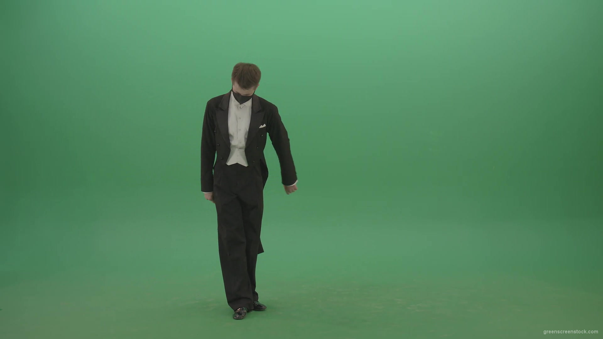 Man-in-Classical-ballroom-suite-making-wish-regards-to-impres-audience-in-black-medicine-mask-on-green-screen-4K-Video-Footage-1920_005 Green Screen Stock