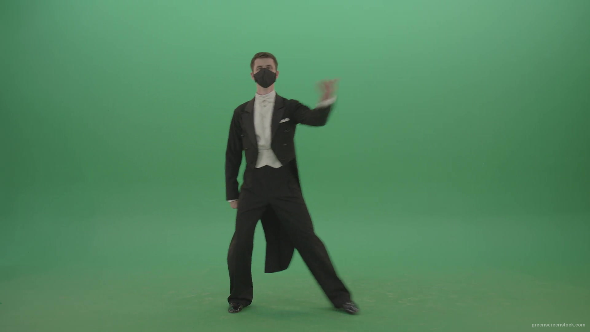Man-in-Classical-ballroom-suite-making-wish-regards-to-impres-audience-in-black-medicine-mask-on-green-screen-4K-Video-Footage-1920_006 Green Screen Stock