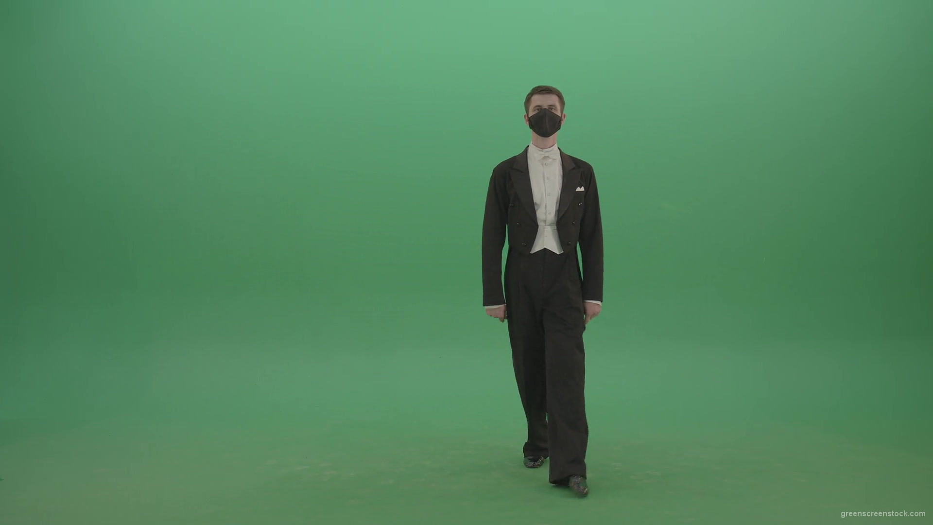 Man-in-Classical-ballroom-suite-making-wish-regards-to-impres-audience-in-black-medicine-mask-on-green-screen-4K-Video-Footage-1920_009 Green Screen Stock
