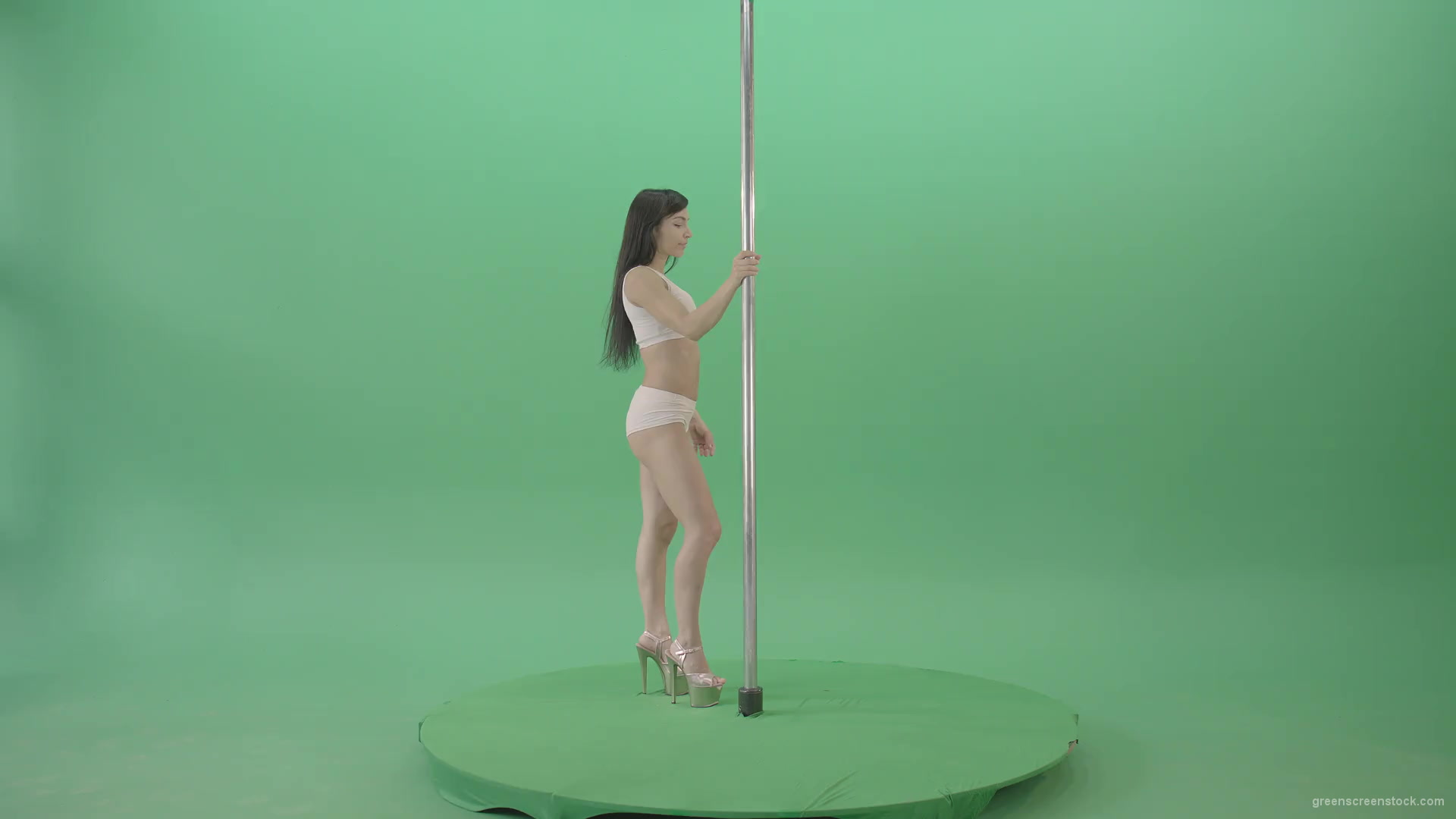White-dressed-Girl-spinning-down-head-on-pole-dance-on-green-screen-4K-Video-Footage-1920_001 Green Screen Stock